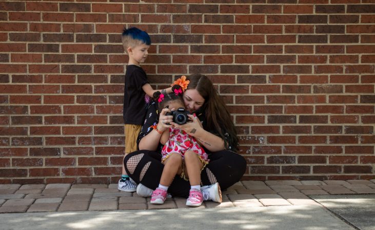 photographer with kids and camera