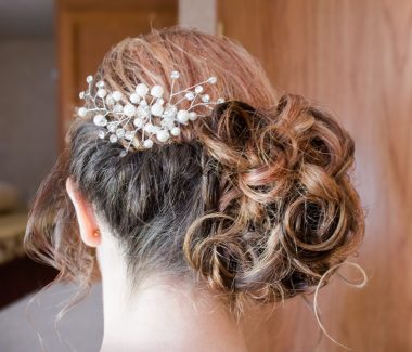 the bride's hair with a beautiful hairpiece