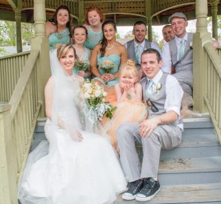 wedding party on steps to gazebo