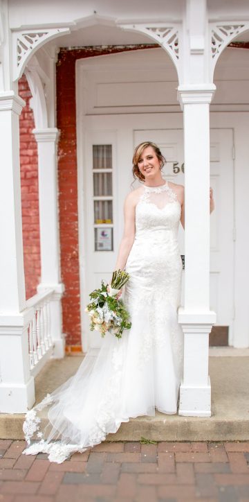 bridal portrait standing on stoop by a column