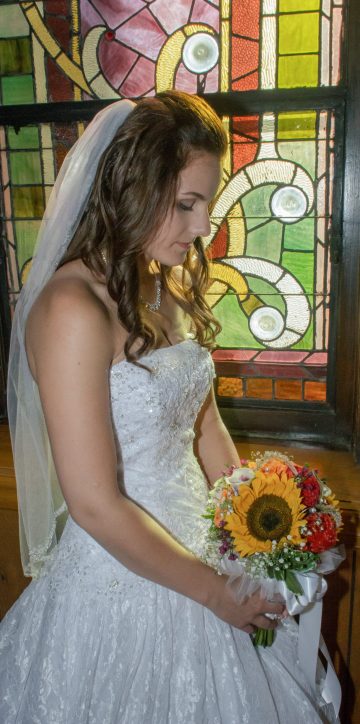 bride looking at her bouquet