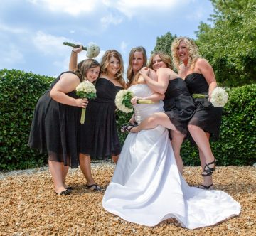 Bride and bridesmaids having fun